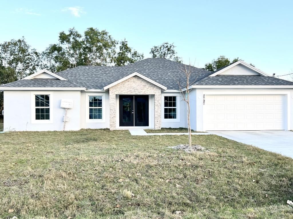 Photo of 5797 NW Coosa Drive, Port Saint Lucie, FL 34986 (MLS # R10956974)