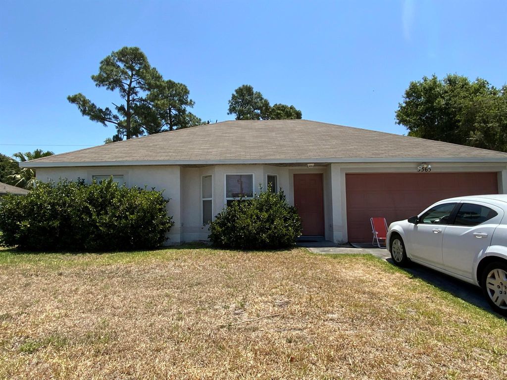 Photo of 3365 SW Mundy Street, Port Saint Lucie, FL 34953 (MLS # R10986915)