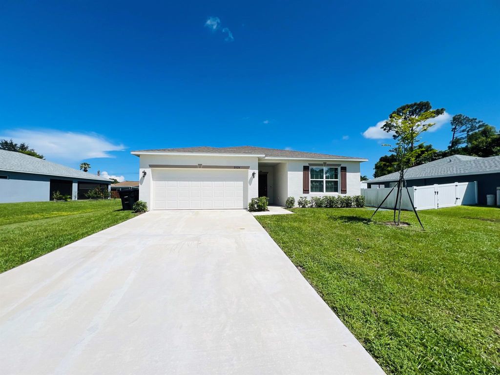 Photo of 2624 SW Ann Arbor Road, Port Saint Lucie, FL 34953 (MLS # R11024329)