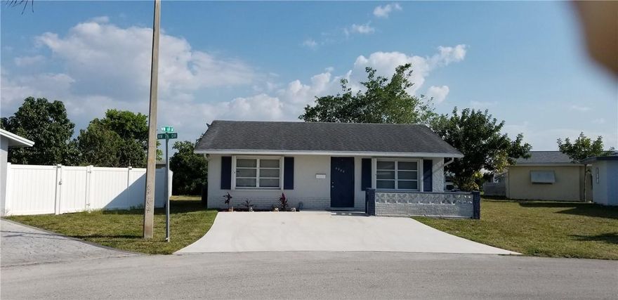 Ready for Immediate occupancy this lovely 2/2 with new large ceramic tile flooring throughout, completely remodeled bath and freshly painted offers complete appliance package including washer/dryer, roof installed 2015, A/C 2016, large screened patio overlooks spacious garden area on pie shaped lot, located across from Clubhouse and rec area with pool and sunbathing.  Home has accordion shutters for easy storm protection. Owner pays $50 p/m for lawn cutting. Fencing permitted with approval. Renting permitted after 1 year. This community is All Ages.