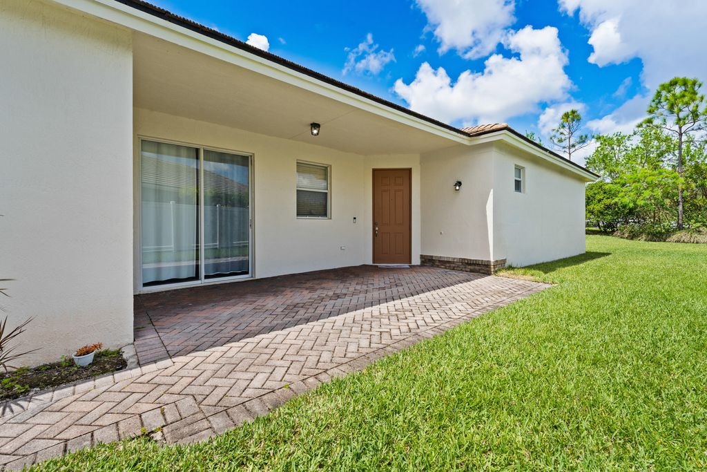 Photo of 9558 SW Flowermound Circle, Port Saint Lucie, FL 34987 (MLS # B26021582)