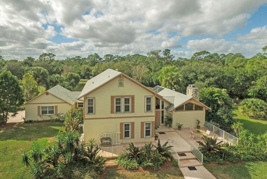 Move right into this country estate home and bring your family & animals! This gated & fenced 5 acre estate is located close to the end of a quiet Palm City Farms St. Totally redesigned & remodeled in 2003, this home has been meticulously maintained by the current owner. Features include 3/4 bdrm, 3 bth, 2 car garage, accordion storm shutters for all windows, laminate flooring in all living areas, stainless appliances, gas stove & great open floor plan! The expansive upstairs master suite opens out onto a private balcony overlooking the pond & back pasture. Large center aisle barn includes 2 stalls, tack & feed rms, 1/1 apt (rents for $800 per month). Lots of room to park your extra vehicles & close to I95 & Turnpike. Perfect opportunity to live your country lifestyle in peace & quiet!