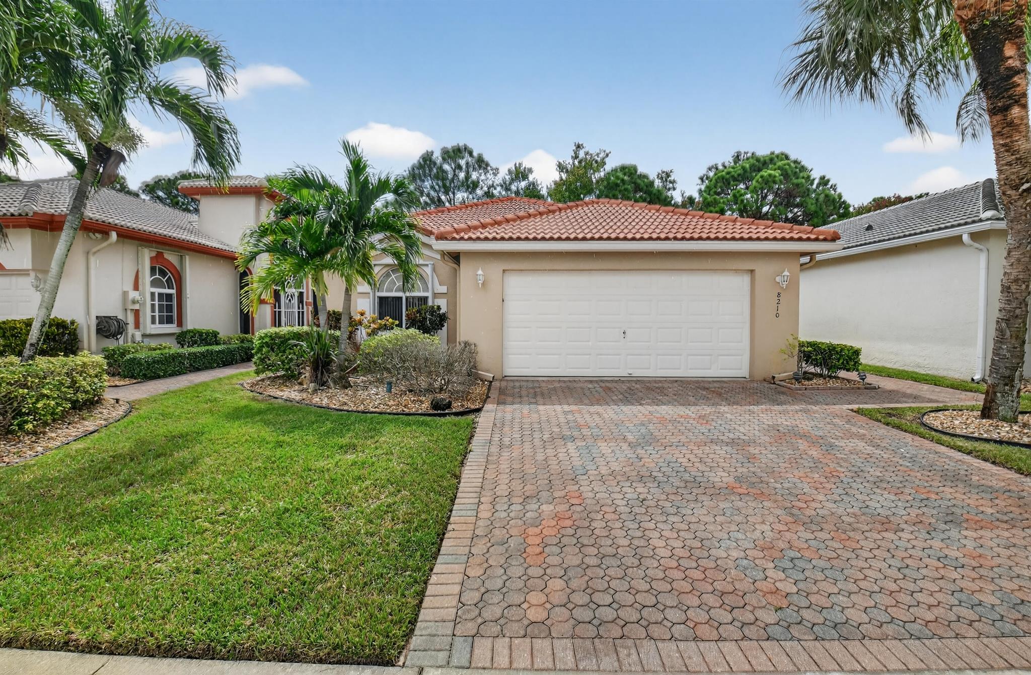 This 3/2, is FRESHLY PAINTED w/ a light & airy neutral pallet boasting an open floor plan. Interior has wood floors in the main living/dining areas & spacious bedrooms with ample storage space. Exterior includes accordion shutters for storm protection, a side entrance & a covered lanai that provides both privacy & serenity. Venetian Isles is a 55+ community that offers country club living. Amenities include a new clubhouse w/ a restaurant serving breakfast & lunch, PLUS an upstairs bistro bar that serves dinner. A social hall is utilized for weekly parties & shows, a craft room, billiards & a library. Outside the clubhouse is a large resort-like pool w/hot tub, resistance walking pool, Tennis, Pickleball & Bocce courts. Last but not least, a free-standing state- of-the-art workout room.
