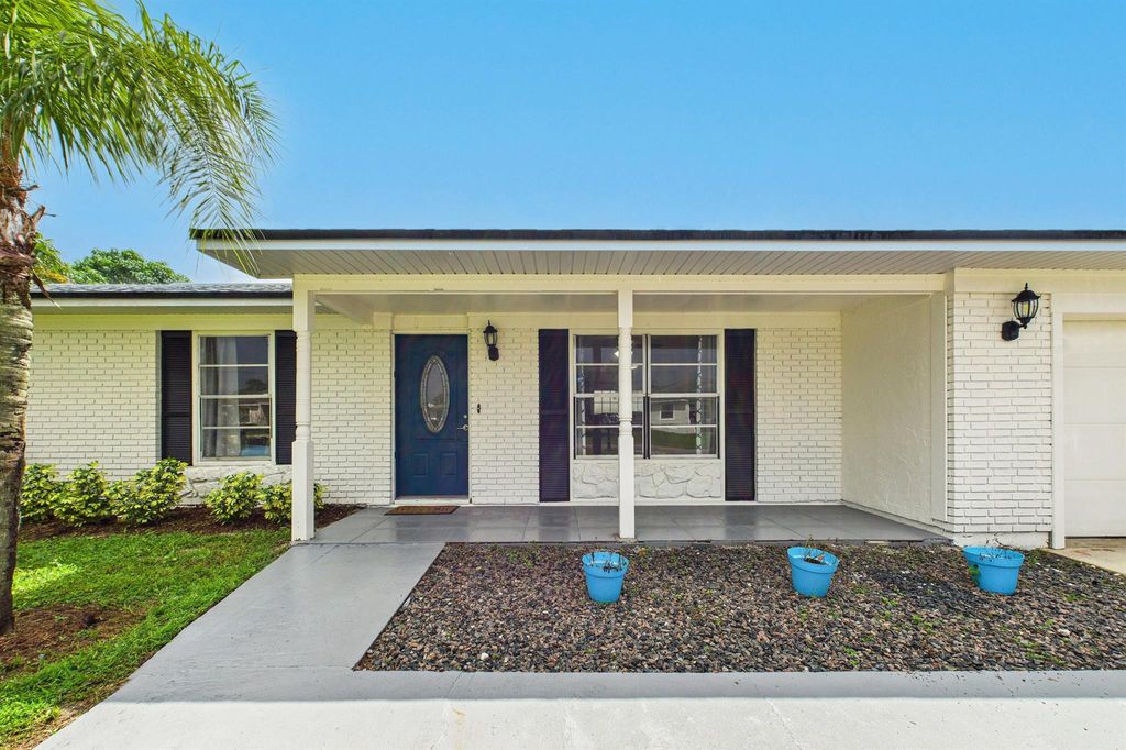 Photo of 708 NW Floresta Drive, Port Saint Lucie, FL 34983 (MLS # R11127908)