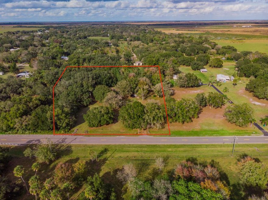 5.15 acres of RM-zoned residential land in Okeechobee offering privacy, space, and natural surroundings, with a creek running along the rear of the property. Property is being marketed and sold for land value only and includes an existing mobile home on site conveying AS-IS with no warranties or repairs. Existing mobile home offers a potential interim use or removal opportunity. Cash buyers only. Buyer to verify zoning, permitted uses, and any removal or replacement options.