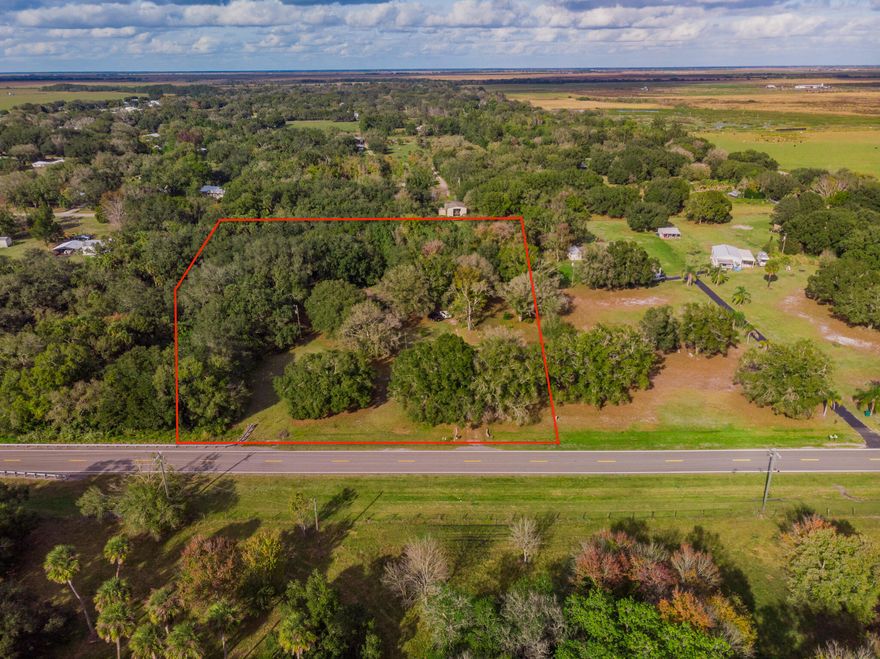 5.15 acres of RM-zoned residential land in Okeechobee offering privacy, space, and natural surroundings, with a creek running along the rear of the property. Property is being marketed and sold for land value only and includes an existing mobile home on site conveying AS-IS with no warranties or repairs. Existing mobile home offers a potential interim use or removal opportunity. Cash buyers only. Buyer to verify zoning, permitted uses, and any removal or replacement options.