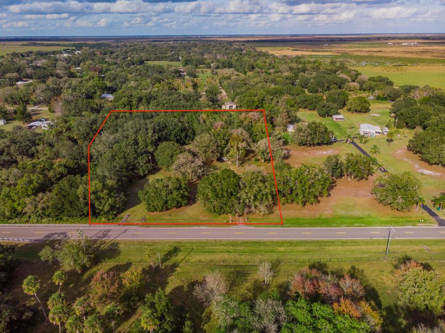 5.15 acres of RM-zoned residential land in Okeechobee offering privacy, space, and natural surroundings, with a creek running along the rear of the property. Property is being marketed and sold for land value only and includes an existing mobile home on site conveying AS-IS with no warranties or repairs. Existing mobile home offers a potential interim use or removal opportunity. Cash buyers only. Buyer to verify zoning, permitted uses, and any removal or replacement options.