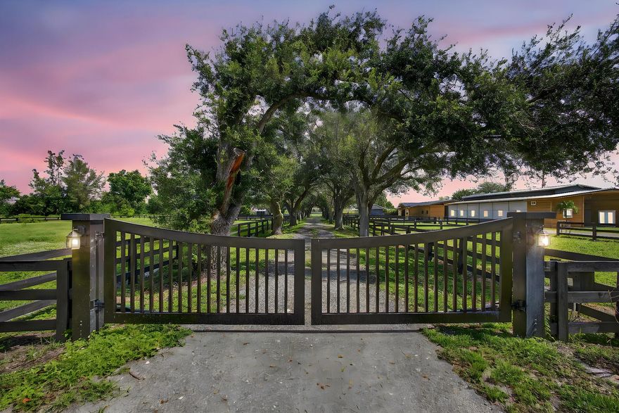 EXCEPTIONAL TURNKEY EQUESTRIAN FACILITY ON 6 ACRES IN RUSTIC RANCHES ESTATESBeautiful equestrian property offering privacy, charm, and functionality in the heart of Rustic Ranches. Walking distance to Wellington's Environmental Preserve and just a short hack to top Wellington shows, with miles of trails at your doorstep.The 4BD/2.5BA home features 2,288 sq ft under air, a garage, pool, and outdoor spaces. Equestrian amenities include 2 new barns (22 stalls), groom's quarters, a horse walker, 7 paddocks, a large field, and room for a riding arena. High and dry property with drainage, public and well water, irrigation, double-fencing, mature oaks, and more. Move-in ready!A MUST-SEE for the discerning equestrian seeking a move-in-ready facility in the heart of Wellington.