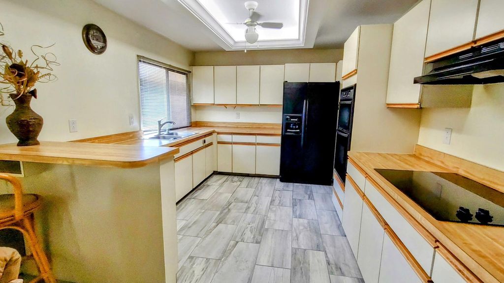 Photo of 2852 SE Farley Road, Port Saint Lucie, FL 34952 (MLS # R10966121)