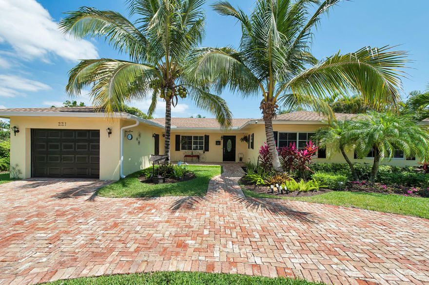 Remarkable home in desirable Lake Ida neighborhood. Grounds are landscaped and backyard with pool is an oasis to enjoy and features a gazebo. Beautifully and completely remodeled and meticulously maintained, this 4 bedroom 3 bath home features, separate dining room, vaulted open ceilings, large laundry room with tons of storage. Home is complete with hurricane impact windows all around, new garage, chicago brick circular driveway and pool deck.  Bright and light open kitchen concept, split bedroom plan, covered front porch entry. Master suit features dual sinks, large master closet and high ceilings.