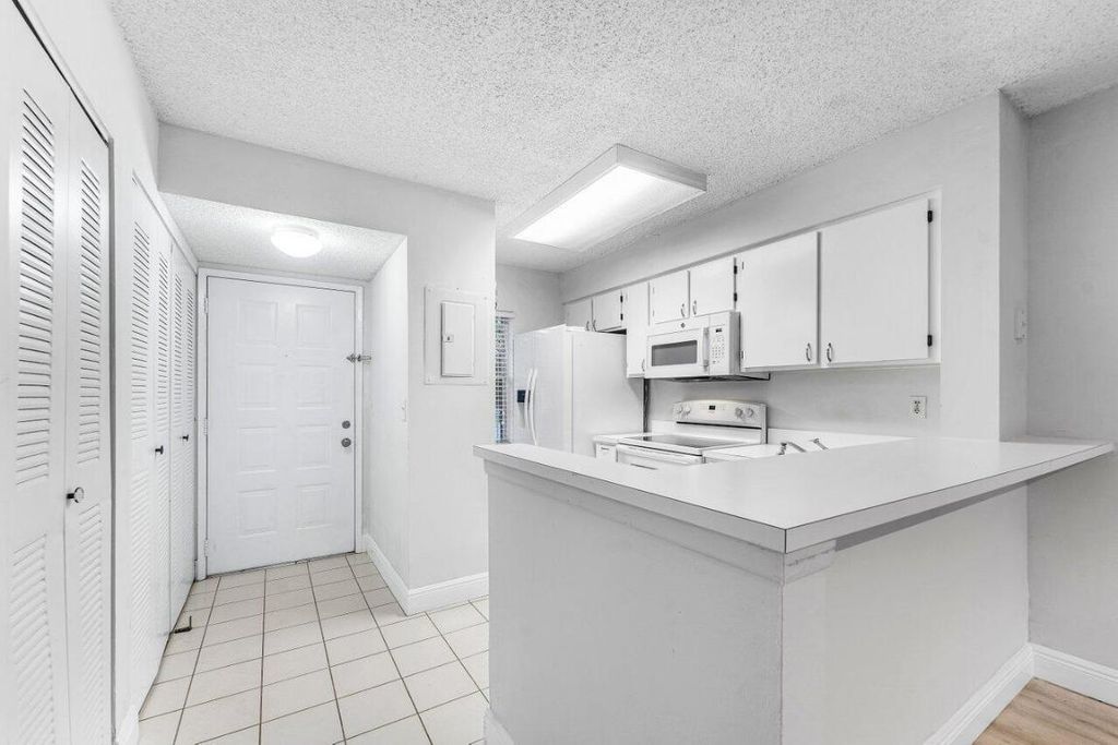 Photo of 2230 N Cypress Bend Drive #209, Pompano Beach, FL 33069 (MLS # R11136122)