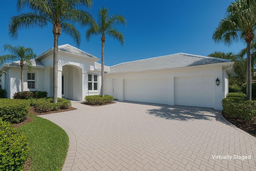 Significant Price Reduction in Monarch Country Club. Now is the perfect time to own this beautifully maintained 3-bedroom, 2.5-bathroom home with a 3-car garage in the heart of Palm City, Florida. This property combines quality construction, stunning golf course and lake views, and an unmatched country club lifestyle on the Treasure Coast. Inside, you'll find soaring 14-foot ceilings, a spacious open-concept layout, and walls of glass that bring in natural light and frame peaceful views of the water and golf course. The large great room flows seamlessly to a screened lanai and back patio, creating the perfect setting for entertaining, grilling, or enjoying your morning coffee or evening cocktail outdoors.