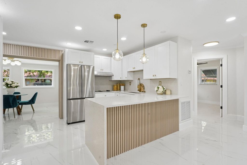 Photo of 1527 Live Oak Drive, West Palm Beach, FL 33415 (MLS # B26018860)