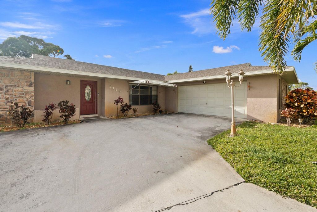 Photo of 2146 SE Dolphin Road, Port Saint Lucie, FL 34952 (MLS # R10958009)