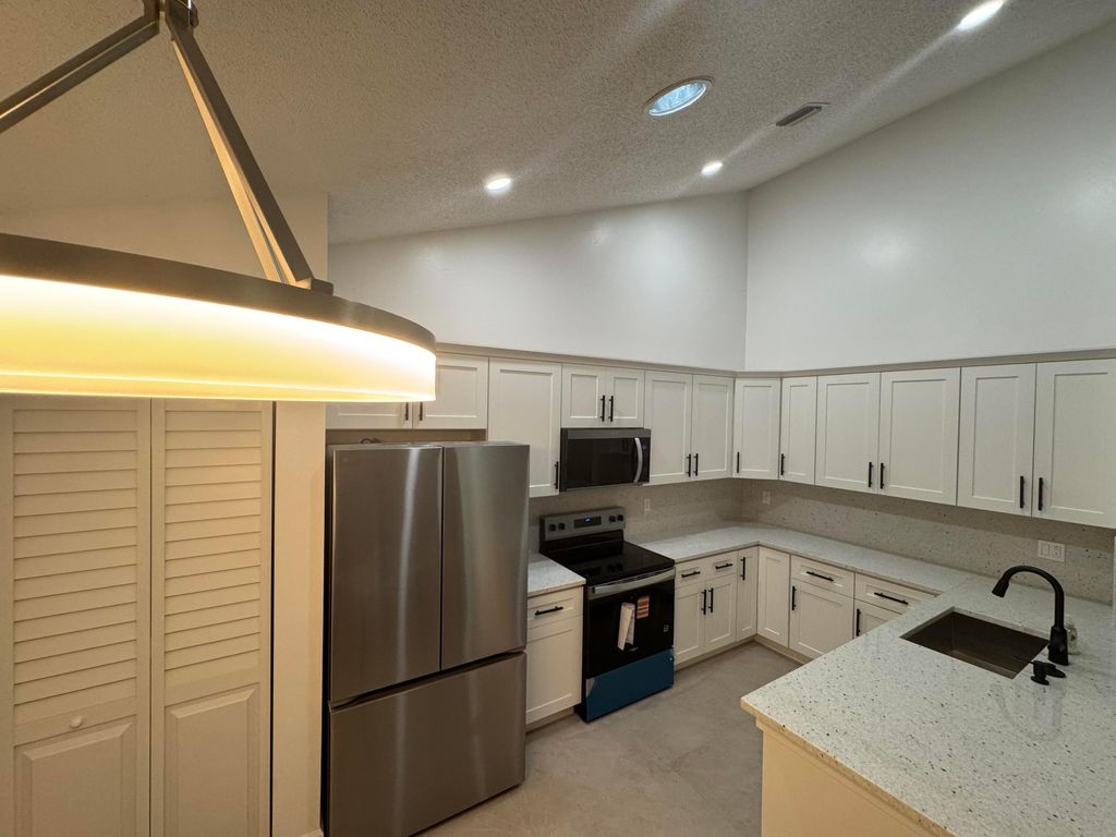 Photo of 1148 Summit Trail Circle #D, West Palm Beach, FL 33415 (MLS # B26011430)