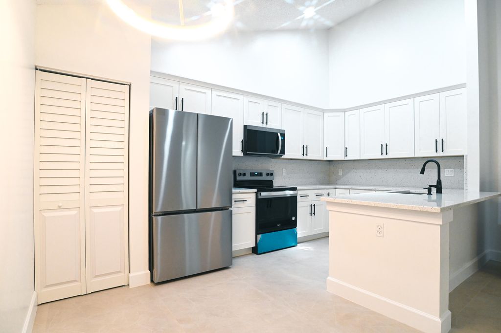 Photo of 1148 Summit Trail Circle #D, West Palm Beach, FL 33415 (MLS # B26011430)