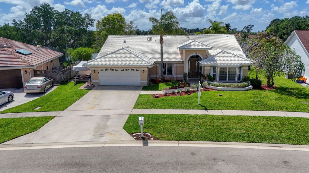 Photo of 115 Waterway Road, Royal Palm Beach, FL 33411 (MLS # B26012229)