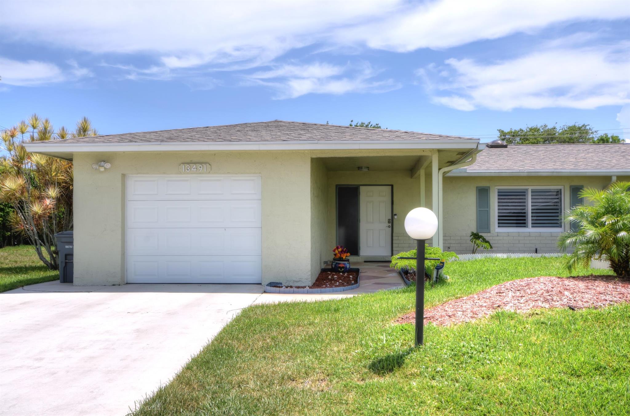 Extensively remodeled two bedroom/two bath villa home with den in 55+ community of Delray Villas. Corner lot with canal view; no homes behind for privacy. Skylights and granite counter tops in both bathrooms. Energy efficient high-hat lighting throughout. New roof in 2020. New A/C, hot water heater and washer in 2021. Following items all new since Feb. 2024: Waterproof gray vinyl plank flooring throughout. Remodeled kitchen including custom pantry, quartz counter tops, quartz sink, sensor faucet, garbage disposal, stove, microwave, refrigerator and beverage cooler. Impact windows throughout; double french impact doors to patio. Master bathroom updates including frame-less shower doors, mirror, light fixture, towel bars and toilet. Custom closets in master bedroom and guest bedroom.