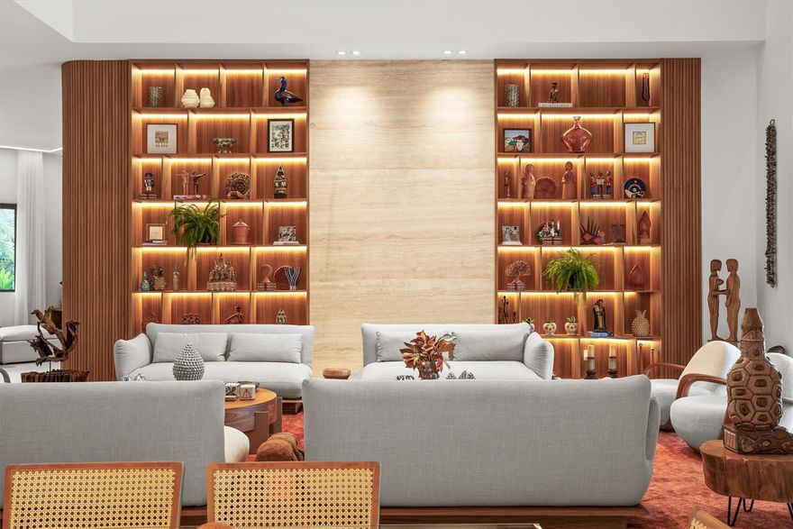 Presenting a top-to-bottom reconstruction: Weston’s foremost statement in modern luxury, an exquisite waterfront estate on a full acre within guard-gated Windmill Ranch Estates. A custom masterpiece, it offers 7 bedroom suites and 8.5 baths, each with walk-in closet; the primary retreat features a boutique-caliber dressing room and spa sanctuary. Soaring 18–22-ft ceilings, seamless flooring, and bespoke chef’s cabinetry showcase uncompromising craft. Peace of mind: newer roof, full impact glass, elevated finishes. Outdoors, a private resort, golden-hour lake vistas, designer pool/spa, summer kitchen, covered dining, and generous lounges. 3-car garage + 2-car carport, circular drive, gas service. Private tours by appointment. In Weston’s effortless Florida living. You must see it to Believe