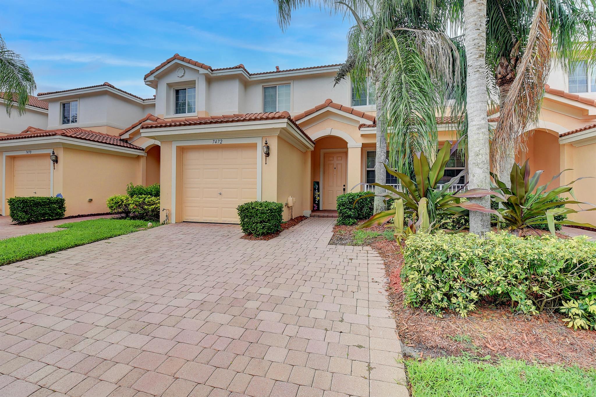 A MUST SEE!!! Newly Remodeled Townhome at desirable Briella community in Boynton Beach. Very spacious and bright, open floor plan, freshly painted, tile throughout the first floor and wood flooring on the second floor. Window treatments, and Hurricane Impact Windows. Amazing and serene views of the preserve, great privacy with no neighbors behind. One car garage with a 2 car driveway. Sits directly across guest parking, mailbox, and clubhouse. Great community with many amenities such as pool, tennis courts, basketball court, kids play area and more.