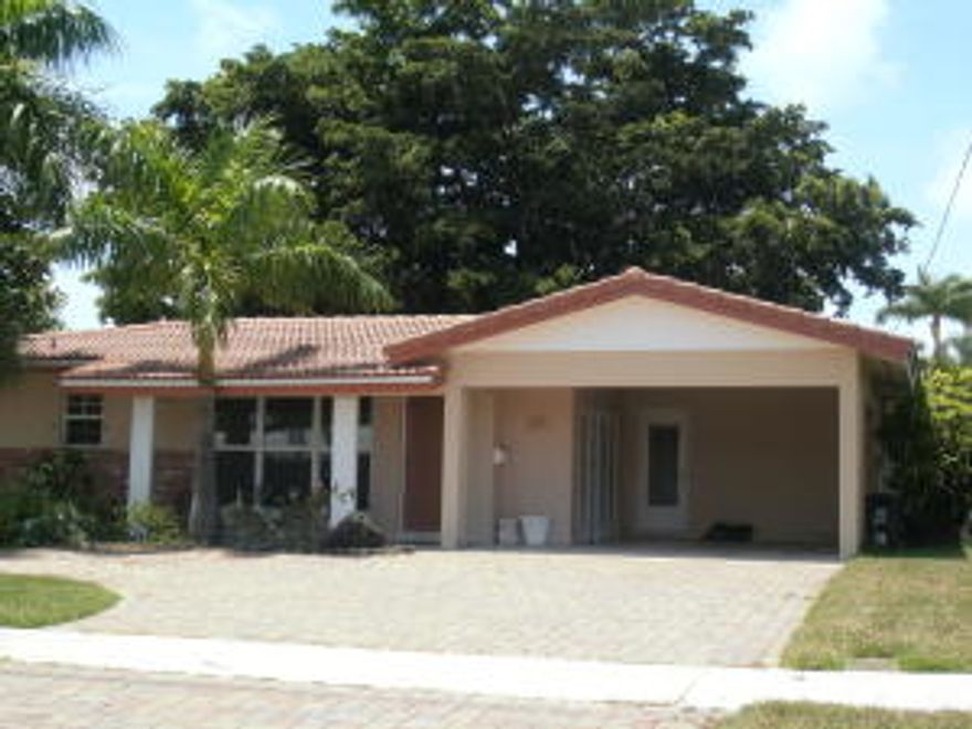 LOCATION-LOCATION-LOCATION!!! CUL-DE-SAC STREET

GREAT 2/2 SPLIT BEDROOM PLAN WITH  IMPACT WINDOWS & DOORS, TILE IN LIVING AREAS & CARPET IN BEDROOMS. FEEL THE CHARM WITH FRENCH DOORS LEADING TO BACK PAVERED PATIO OVERLOOKING CANAL. KITCHEN & BATHS RENOVATED IN 2007 WITH WOOD CABINETRY & GRANITE. LARGE EAT-IN KITCHEN, SMALL ROOM OFF MASTER COULD BE NURSERY OR OFFICE. S-TILE AND FLAT ROOF APPROX 14 YEARS OLD. HOT WATER HEATER 4 YEARS OLD. NEW ELECTRICAL PANEL 2015. ONLY 1 BRIDGE (FEDERAL HWY) TO INTRACOASTAL.