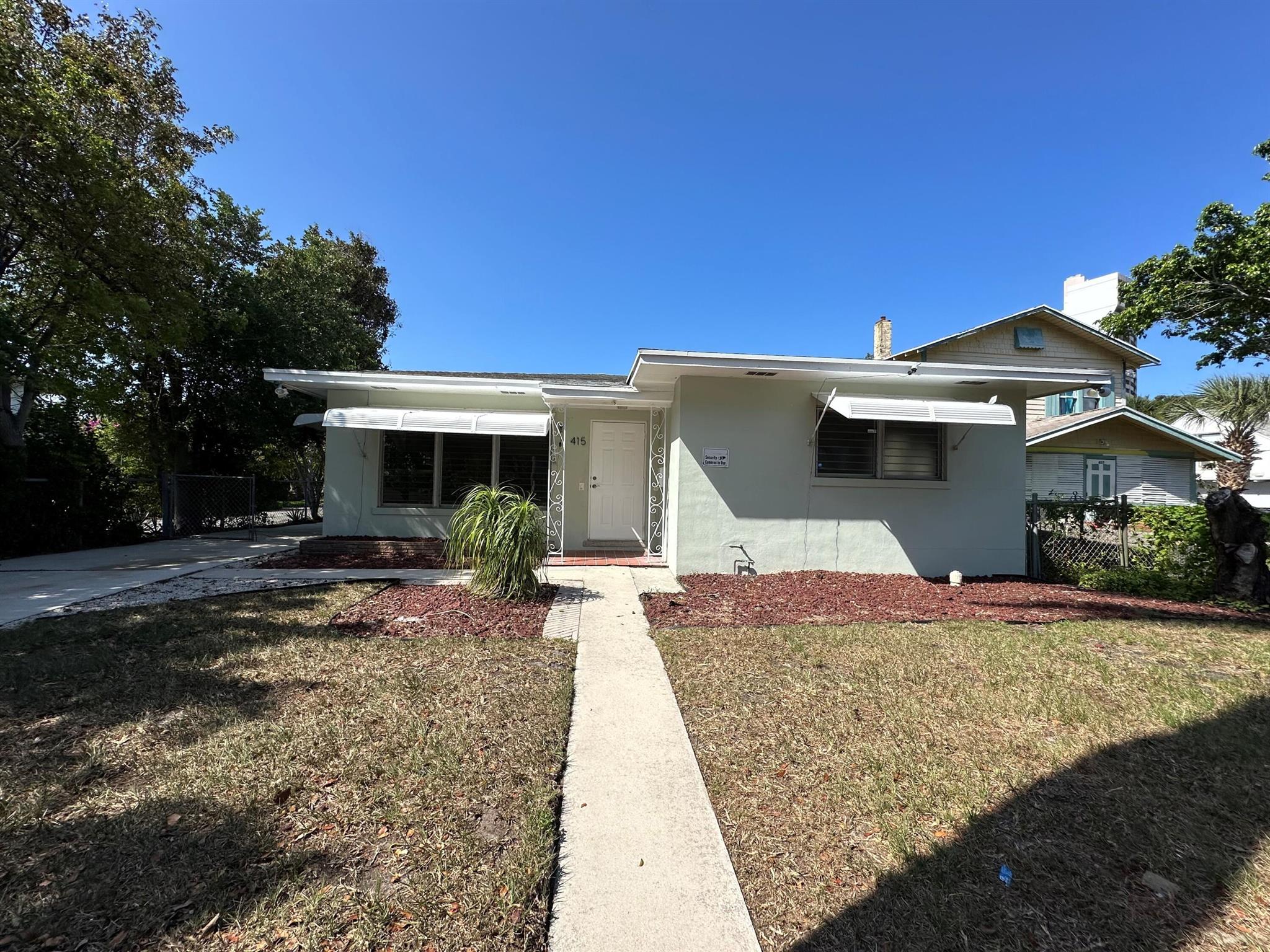 Beautiful 2 bedroom 1 bath home located off North Flagler Drive in Northwood Harbor. This 1950s mid-century style home offers terrazzo floors throughout, open concept and kitchen with granite countertops and gas range. Freshly painted inside and out. The outdoor space has fenced in back yard with ample gated parking. Located near Downtown West Palm Beach and minutes to the Sailing Club, dog park and the Intracoastal Waterway. Pets welcome!
