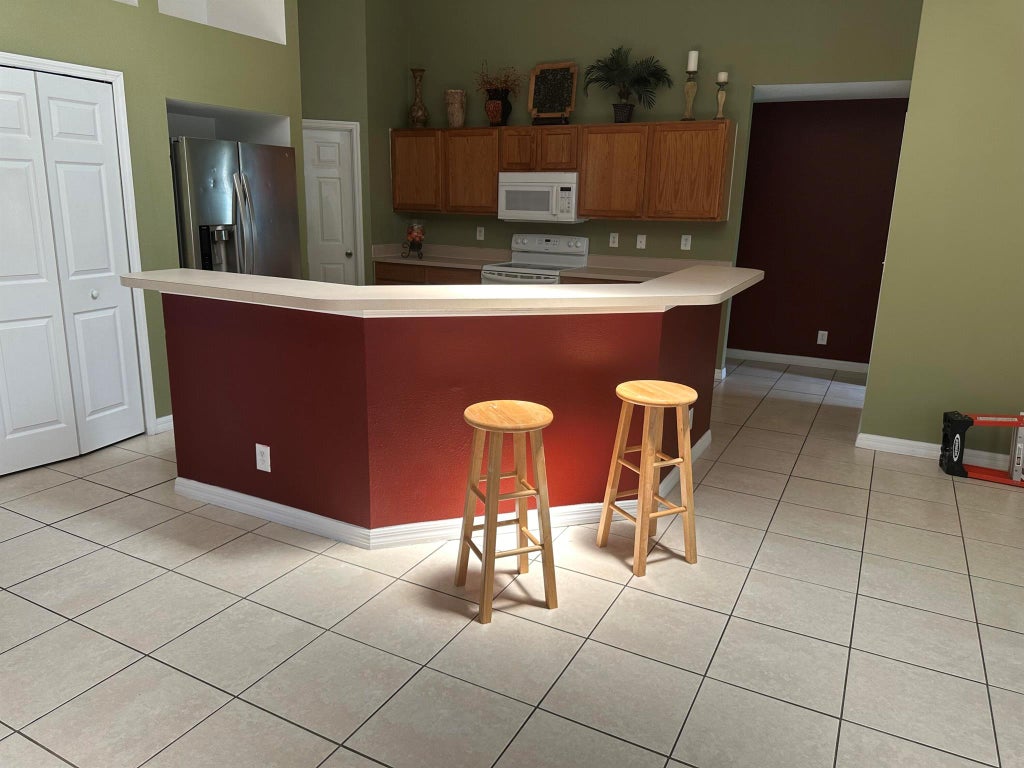 Photo of 2061 SW Salvatierra Boulevard, Port Saint Lucie, FL 34987 (MLS # R10997630)