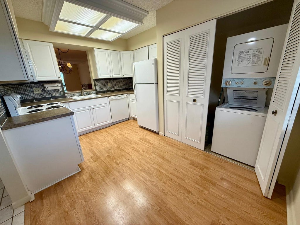 Photo of 2212 S CYPRESS BEND Drive #303, Pompano Beach, FL 33069 (MLS # B26072839)