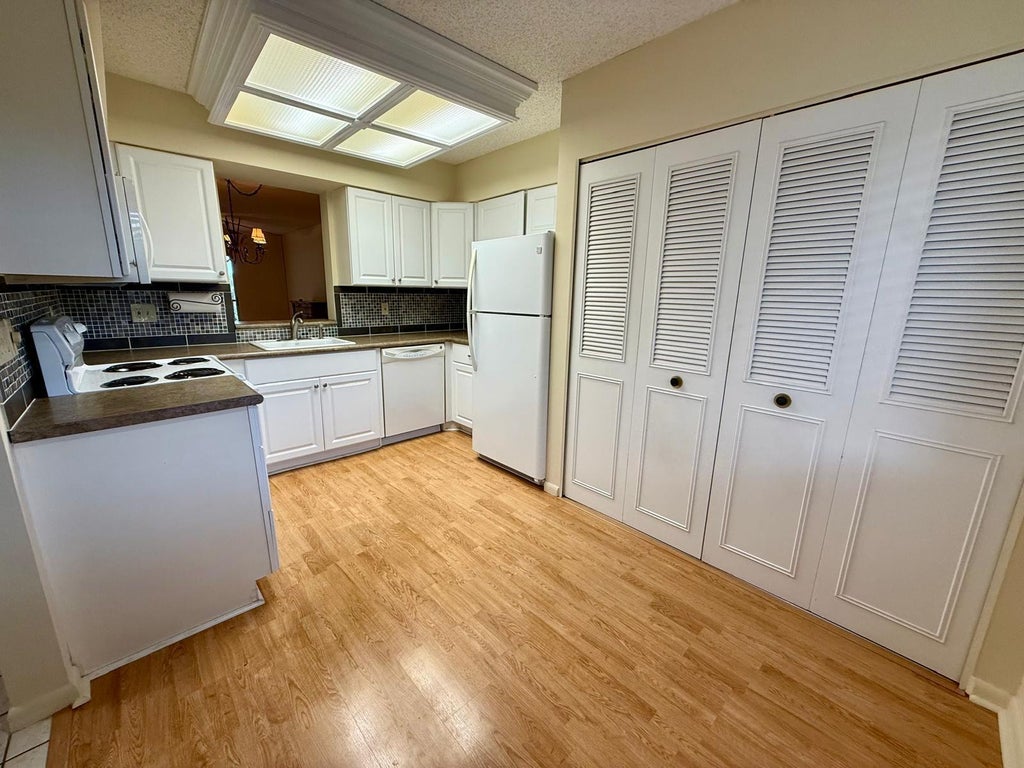 Photo of 2212 S CYPRESS BEND Drive #303, Pompano Beach, FL 33069 (MLS # B26072839)