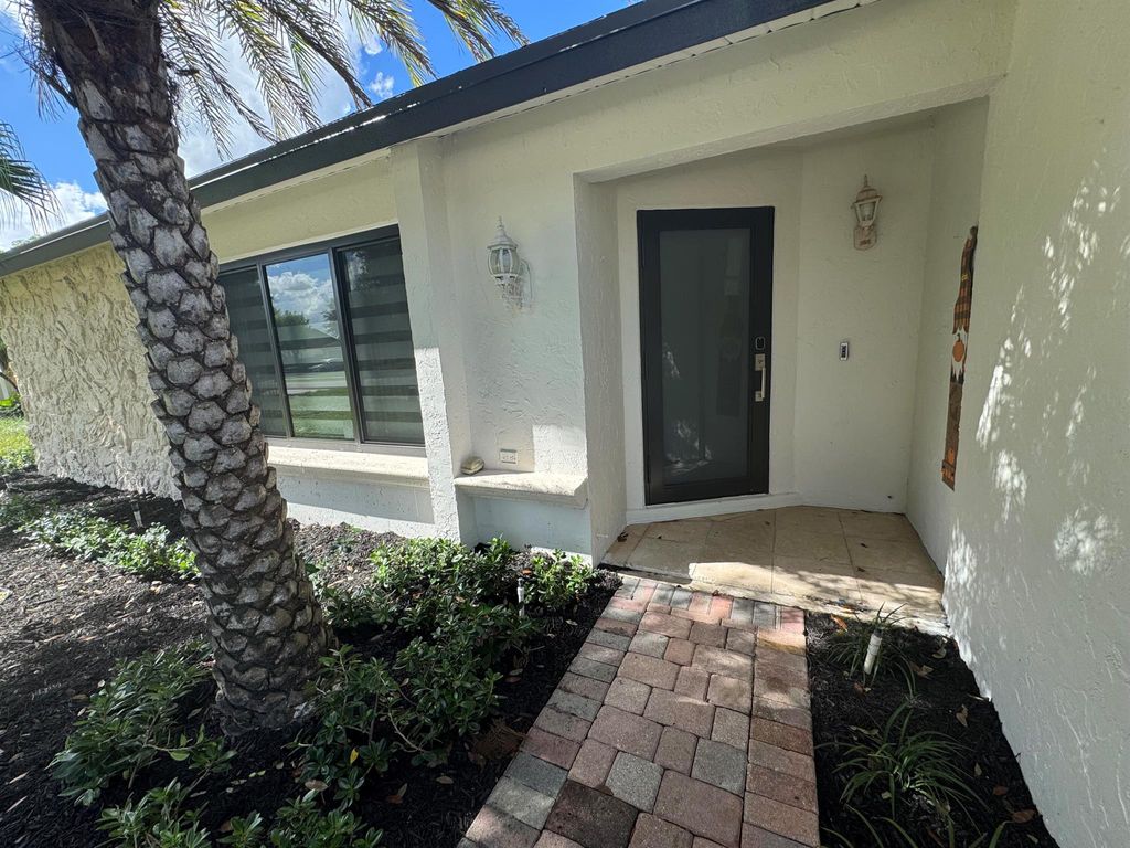 Photo of 1467 Mcdermott Lane, Royal Palm Beach, FL 33411 (MLS # R11126353)