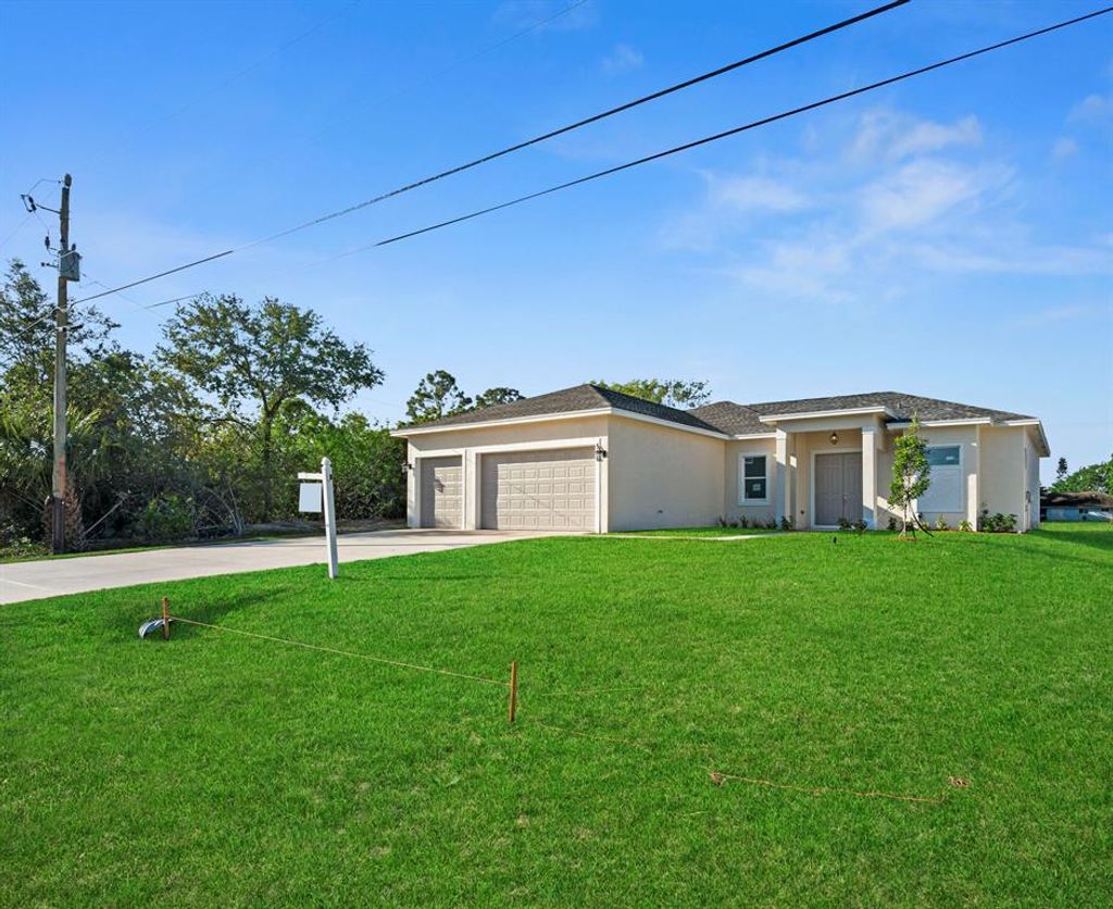 Photo of 2366 SW Blaine Terrace, Port St Lucie, FL 34953 (MLS # R10876486)