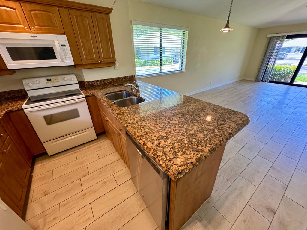 Photo of 705 Club Drive, Palm Beach Gardens, FL 33418 (MLS # R10990672)
