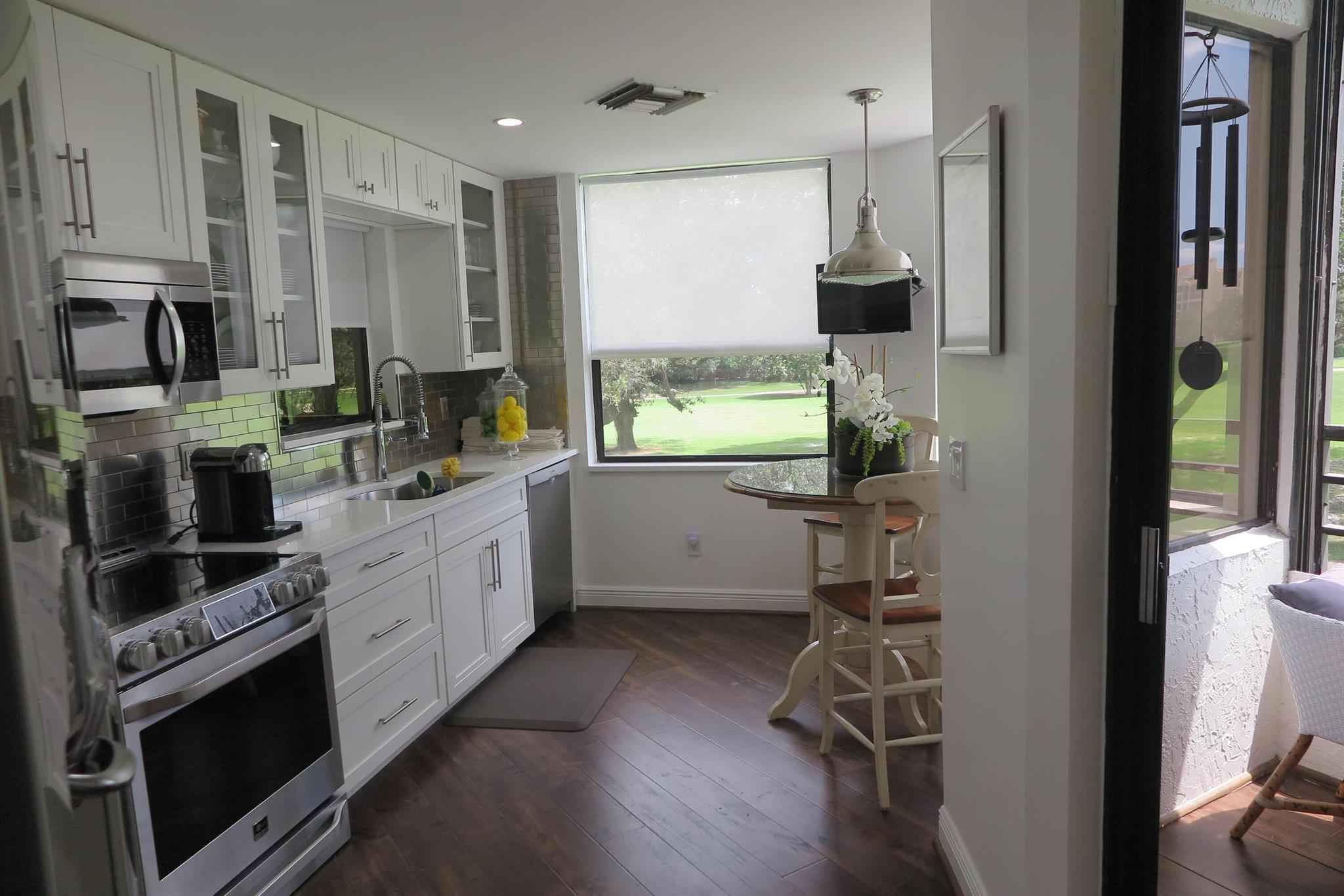 Absolutely stunning furnished seasonal rental They don't come better than this! Turnkey. Completely remodeled spacious unit with gorgeous golf views. Decorator furnishes throughout with all the added touches. Split floor plan. Enclosed patio for extra living space. Additional patio off kitchen. Full-size washer and dryer. Covered carport parking. Two community pools and tennis courts. 4 month minimum. Cable, internet and water included. Conveniently located in the beautiful gates of Boca Pointe. (copy of floor plan in documents).