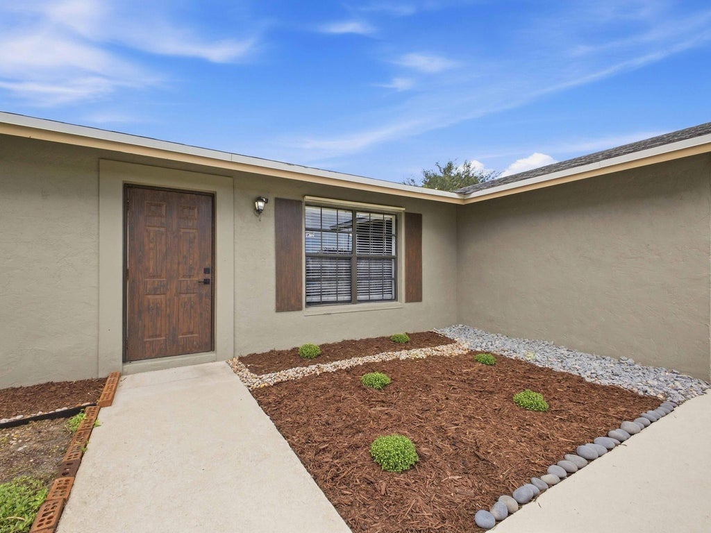 Photo of 234 La Mancha Avenue, Royal Palm Beach, FL 33411 (MLS # B26075708)