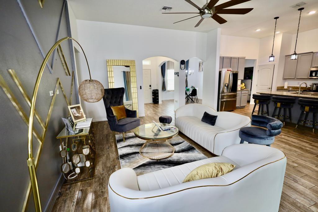 This is a beautiful 4BR, 3BA home with a den on an oversized lot. Freshly painted with wood-look tile floors and 12 foot ceilings. The heart of the home boasts a gourmet kitchen with granite counters, a large island, and breakfast nook. Newly updated kitchen with open layout that connects the kitchen, dining, and living areas. The split plan includes a lavish master suite complete with a private en-suite bath and large walk-in closet. Outdoor sitting and a beautiful backyard. Great location with no HOA