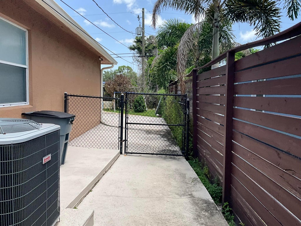Photo of 315 SW Dwight Avenue, Port Saint Lucie, FL 34983 (MLS # B26059845)