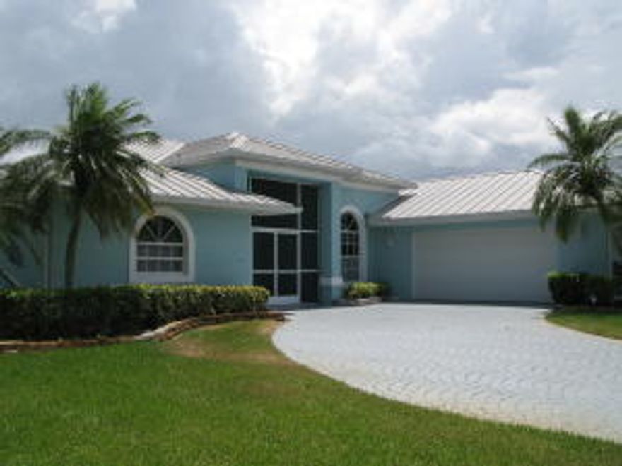 This stunning 3/2/2 home in Gator Trace has everything you could hope for.  Double door entry leads you into the spacious living room with separate formal dining.  Open kitchen offers granite counter tops, snack bar, and lots of cabinet space.  Enjoy spectacular views of the 14th hole from the family room and breakfast nook.  Relax year round in the fully air conditioned/heated expansive back porch. Impact glass windows throughout entire home. Master BR bathroom has been updated to include granite, dual sinks, separate glass block shower and Roman tub. Tile and laminate flooring, custom window treatments. Newer appliances, central vac, newer AC  w/air purifier, metal roof 2005, plus home warranty. Experience Florida living at it's finest in this charming community!