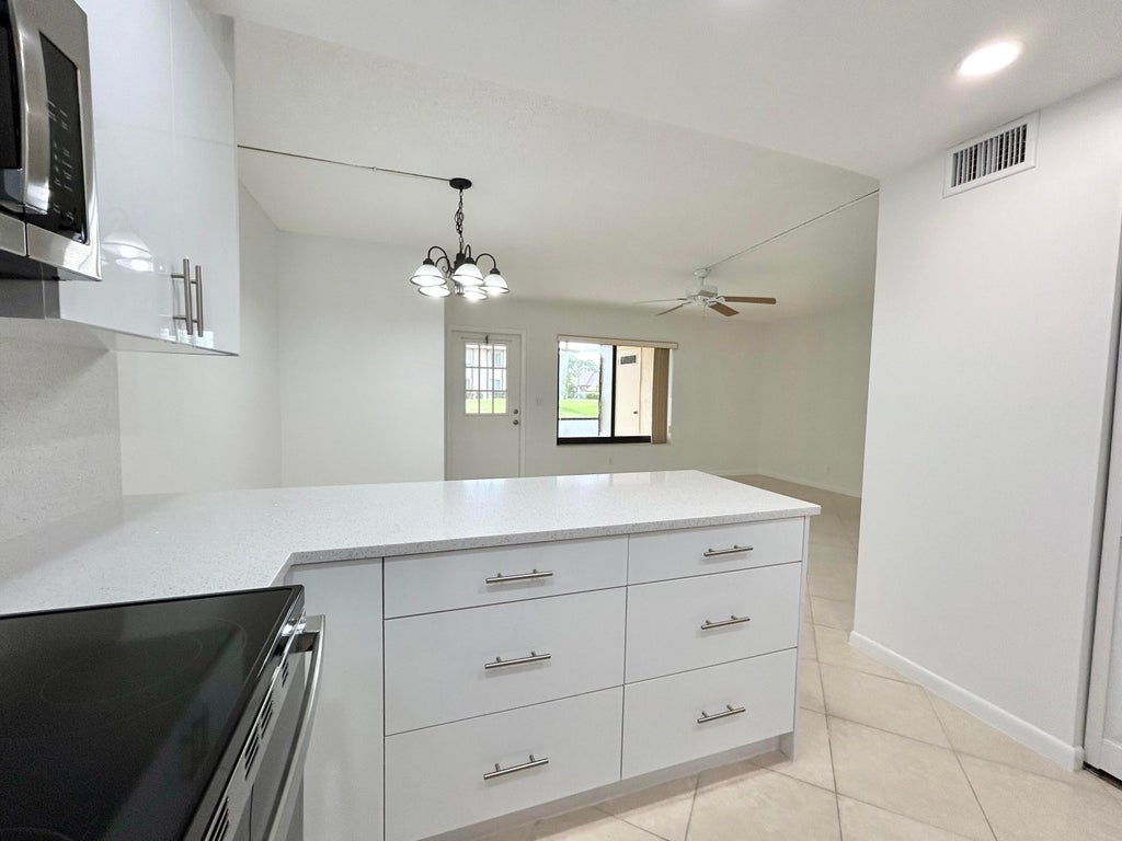Photo of 418 Pine Glen Lane #C-1, Greenacres, FL 33463 (MLS # B26042788)