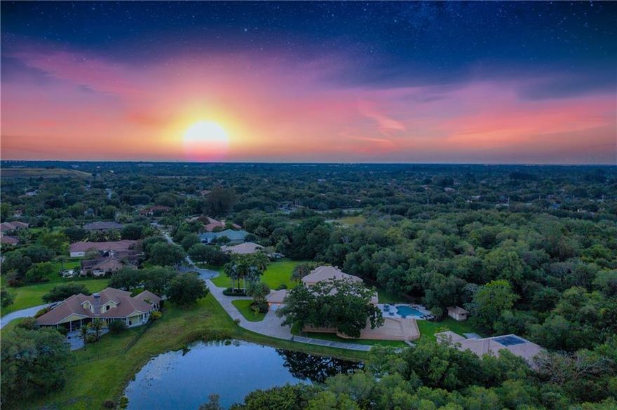 This ultra-private estate is in a league of its own, offering a compound tucked away in a secure, gated community with only 9 properties. Sitting on 3.5-acres and surrounded by a lush nature preserve, the home has everything you could ever need. Grand entrance with light-filled, double-height foyer leads to the living room featuring a fireplace and carved marble columns. Chef’s kitchen offers double islands, custom cabinetry, double oven, gas cooktop, warming drawers, 2 dishwashers, built-in grill. The master suite features impressive his/her closets & a marble bathroom. Dining room, game room, office, and gym. Entertainer’s paradise overlooking a tranquil lake with covered terraces, summer kitchen, oversized, heated pool, sprawling deck shaded by a breathtaking ancient oak tree... This ultra-private estate is in a league of its own, offering a compound tucked away in a secure, gated community with only 9 properties. Sitting on 3.5-acres and surrounded by a lush nature preserve, the home has everything you could ever need. Grand entrance with light-filled, double-height foyer leads to the living room featuring a fireplace and carved marble columns. Chef’s kitchen offers double islands, custom cabinetry, double oven, gas cooktop, warming drawers, 2 dishwashers, built-in grill. The master suite features impressive his/her closets & a marble bathroom. Dining room, game room, office, and gym. Entertainer’s paradise overlooking a tranquil lake with covered terraces, summer kitchen, oversized, heated pool, sprawling deck shaded by a breathtaking ancient oak tree. This home is constructed like a bunker with reinforced concrete & rebar, impact windows. Laundry room doubles as a safe house and leads to detached 16-car collector’s garage, 5,800 sq ft under A/C with lift, tool room, office & enough space for a boat or motor home.