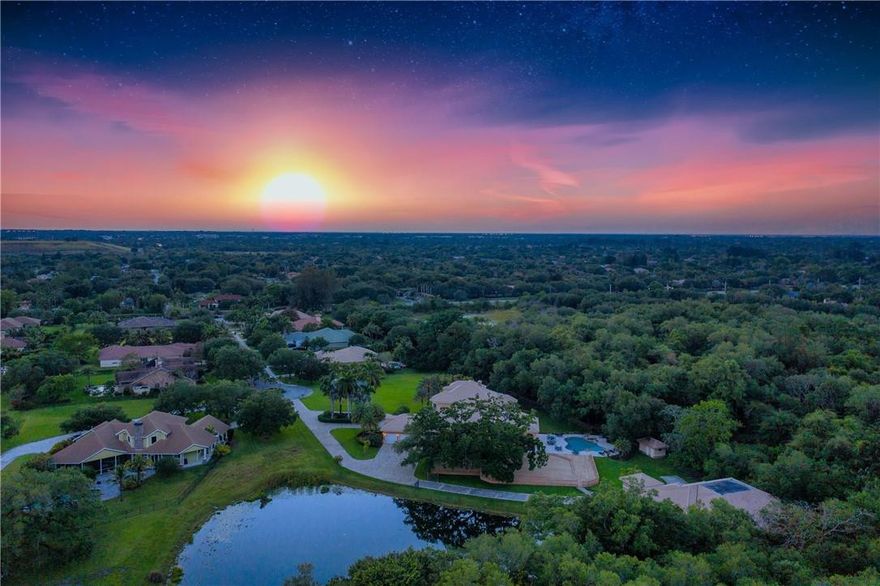 This ultra-private estate is in a league of its own, offering a compound tucked away in a secure, gated community with only 9 properties. Sitting on 3.5-acres and surrounded by a lush nature preserve, the home has everything you could ever need. Grand entrance with light-filled, double-height foyer leads to the living room featuring a fireplace and carved marble columns. Chef’s kitchen offers double islands, custom cabinetry, double oven, gas cooktop, warming drawers, 2 dishwashers, built-in grill. The master suite features impressive his/her closets & a marble bathroom. Dining room, game room, office, and gym. Entertainer’s paradise overlooking a tranquil lake with covered terraces, summer kitchen, oversized, heated pool, sprawling deck shaded by a breathtaking ancient oak tree... This ultra-private estate is in a league of its own, offering a compound tucked away in a secure, gated community with only 9 properties. Sitting on 3.5-acres and surrounded by a lush nature preserve, the home has everything you could ever need. Grand entrance with light-filled, double-height foyer leads to the living room featuring a fireplace and carved marble columns. Chef’s kitchen offers double islands, custom cabinetry, double oven, gas cooktop, warming drawers, 2 dishwashers, built-in grill. The master suite features impressive his/her closets & a marble bathroom. Dining room, game room, office, and gym. Entertainer’s paradise overlooking a tranquil lake with covered terraces, summer kitchen, oversized, heated pool, sprawling deck shaded by a breathtaking ancient oak tree. This home is constructed like a bunker with reinforced concrete & rebar, impact windows. Laundry room doubles as a safe house and leads to detached 16-car collector’s garage, 5,800 sq ft under A/C with lift, tool room, office & enough space for a boat or motor home.