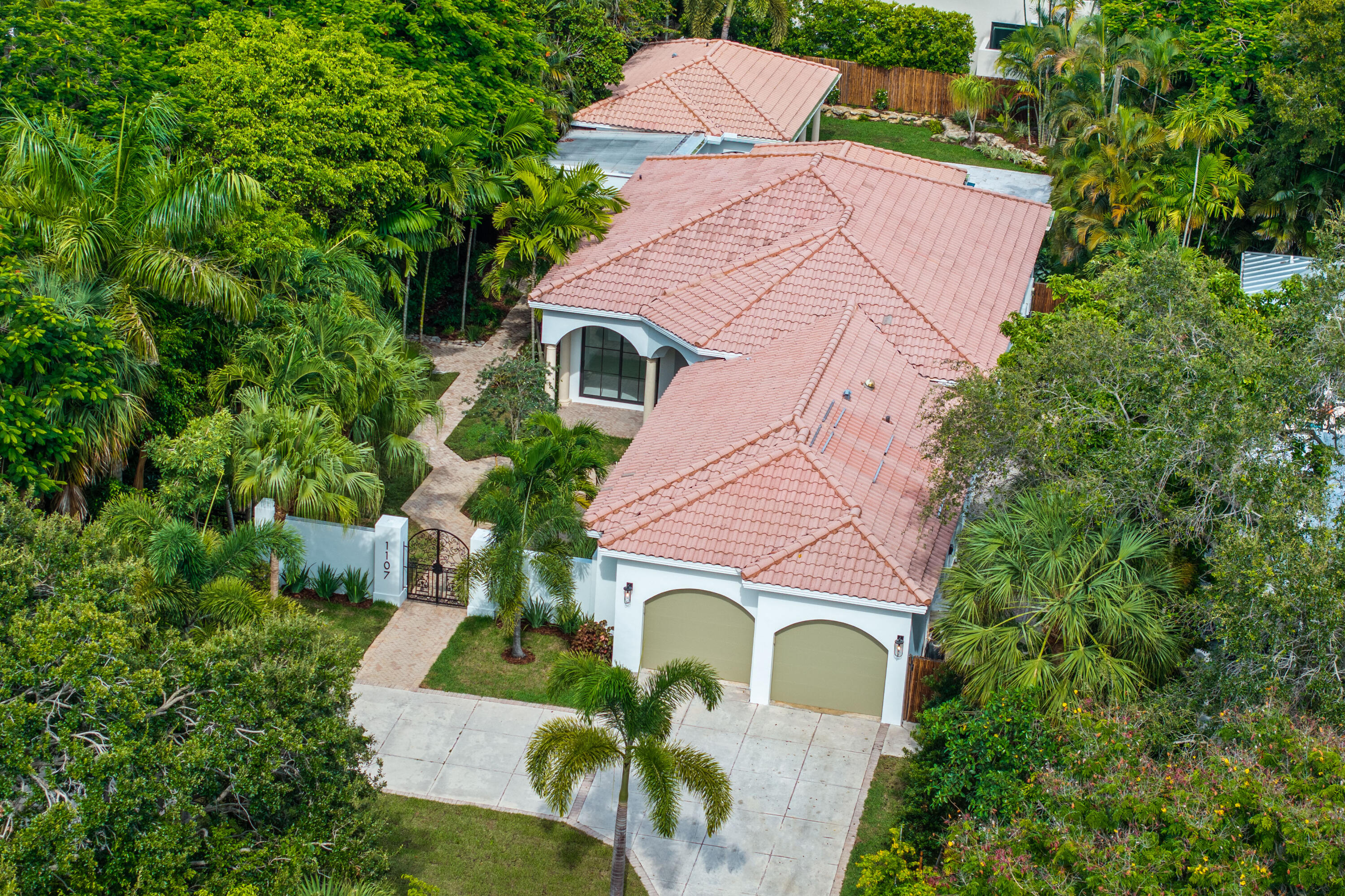 Welcome to this fully reimagined and professionally remodeled residence in Delray Beach's highly sought-after Lake Ida neighborhood. Located on a private cul de sac, this home offers over 3,000 square feet of living space, this home features a separate guest house, a private pool, and a seamless blend of modern design and timeless charm -- perfect for today's lifestyle. Inside, you'll find an open-concept floor plan flooded with natural light, featuring a chef's kitchen with high-end appliances, custom cabinetry, and designer fixtures. Every inch of this property has been thoughtfully redesigned, including new impact windows and doors, updated electrical and plumbing systems, brand-new flooring, spa-inspired bathrooms, and a full cosmetic transformation.