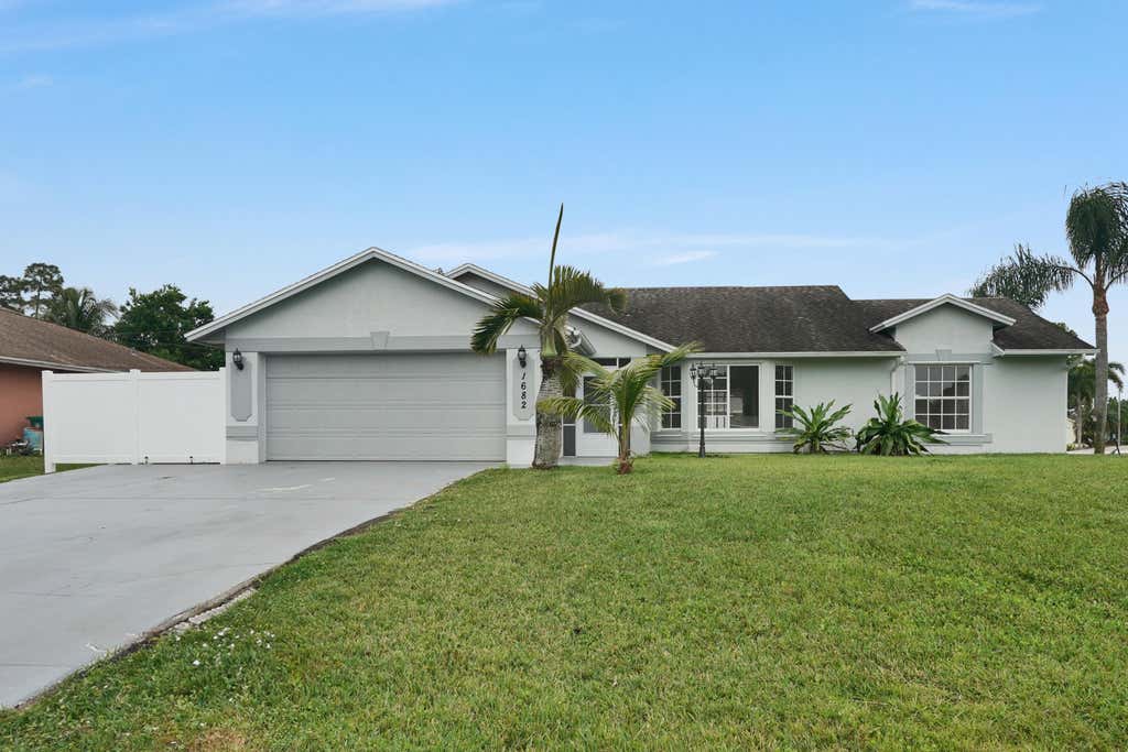 Photo of 1682 SW Duclair Avenue, Port Saint Lucie, FL 34953 (MLS # R10967137)