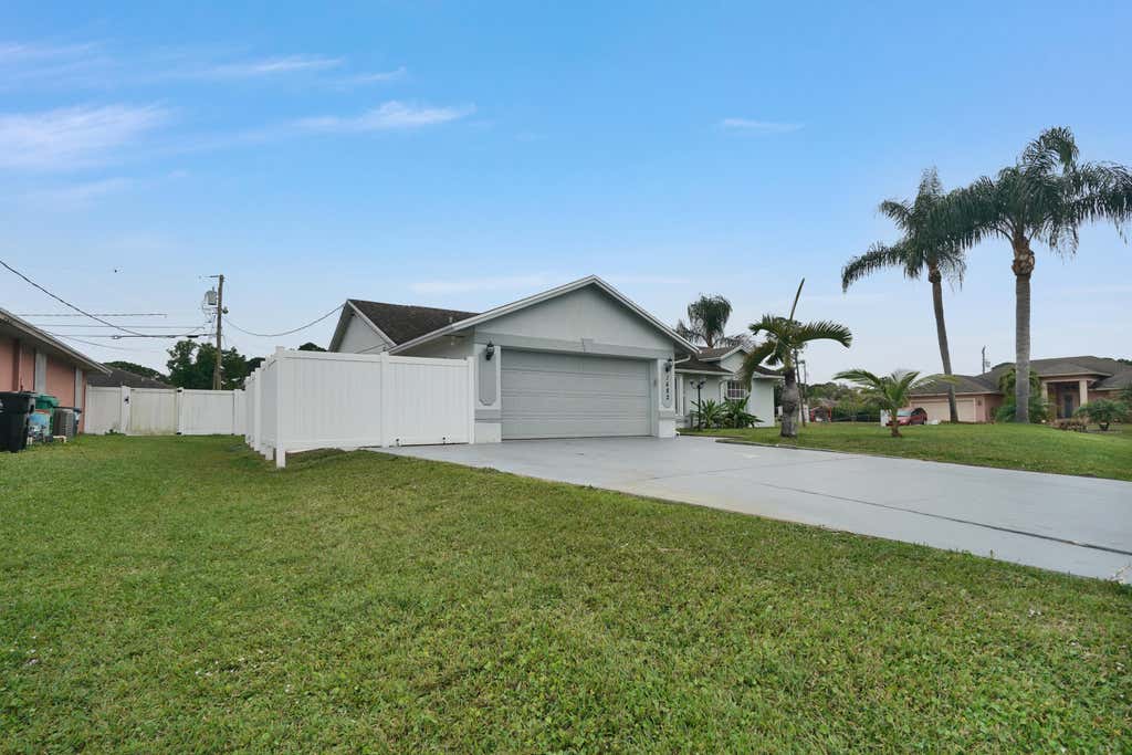 Photo of 1682 SW Duclair Avenue, Port Saint Lucie, FL 34953 (MLS # R10967137)