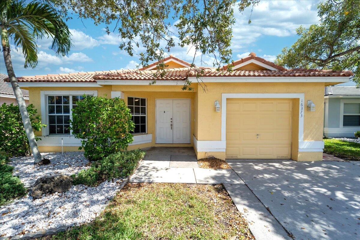 Best value Home in the community of Parkside at Spring Valley! Located in the sought-after 24/7 gated community of Parkside in Pembroke Pines, this beautifully updated single-story home offers comfort, style, and unbeatable value. Featuring 3 bedrooms, 2 full bathrooms, and a 1-car garage.The home sits on a fully fenced lot with a screened-in patio--perfect for outdoor living, pets, and entertaining. Step inside to a light-filled interior with high ceilings, a welcoming foyer, and a spacious open layout. The kitchen is equipped with wood cabinetry, stainless steel appliances, and a functional design that flows seamlessly into the living and dining areas. The primary suite offers a peaceful retreat with a walk-in closet, dual sinks, a soaking tub, and a separate shower. Additional