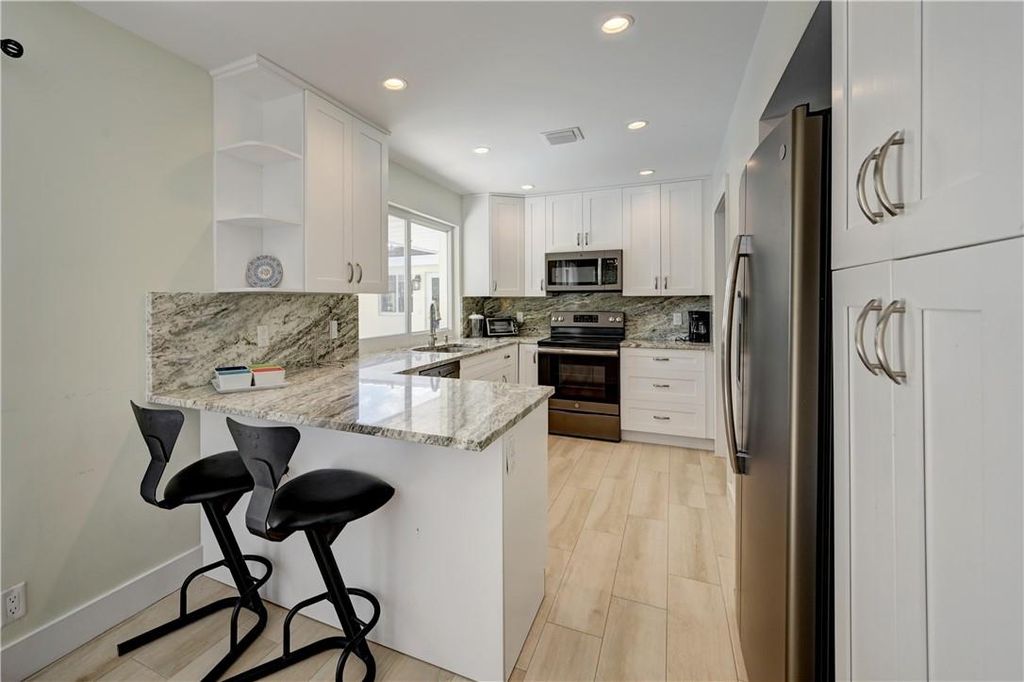 Photo of 840 SW 7th Street, Boca Raton, FL 33486 (MLS # F10412169)