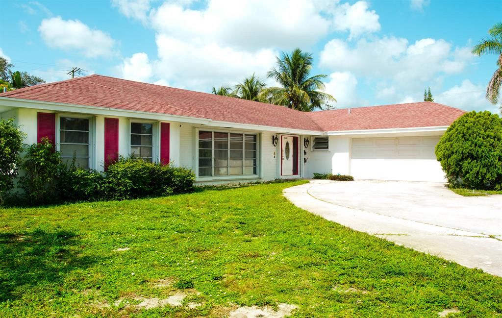 Photo of 340 Park Avenue, Lake Park, FL 33403 (MLS # R10736437)