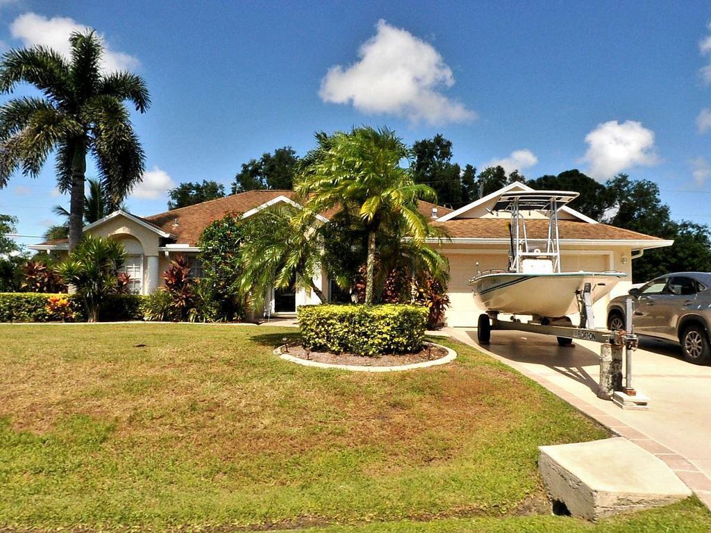 Photo of 5505 NW Evanston Avenue, Port Saint Lucie, FL 34983 (MLS # R10806106)