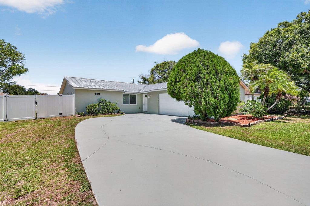 Photo of 2190 SW Kail Street, Port Saint Lucie, FL 34984 (MLS # B26025956)