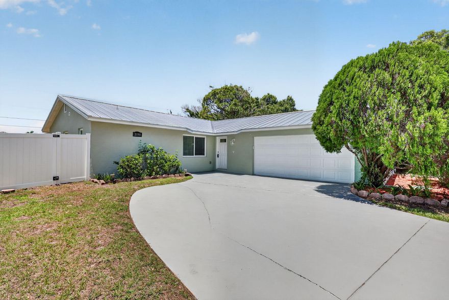 Don't miss out on this beautifully renovated bright, open-concept, move.-in ready home! Interior property features recessed LED lighting, fresh interior paint & newer stainless steel appliances that compliment the stylish kitchen & living spaces. Enjoy peace of mind with a newer metal roof & plenty of room to relax or entertain in the spacious backyard w/privacy fencing & mature fruit trees. Conveniently located just minutes from the Turnpike, shopping, dining, and everyday conveniences, this home combines comfort, style, and an unbeatable location. The sellers put so much into this home; there are too many highlights to list here - be sure to check out the supplemental remarks for a full list of features. Renovations, Upgrades, and Appliances Metal Roof Installation (2023), Impact Windows and Doors (2021), Vinyl Fence (2023), Exterior Home Paint (2023), Conversion from Septic to 2 Step Grinder System (2024), 50 Amp Transfer Switch Installation (2024), Water Heater (2025), A/C (2019), Floors Replaced (2020), Kitchen Remodel (2021), Master and Guest Bathroom Remodel (2021), Home Interior Paint --- Walls and Ceiling (2026), Garage Interior Paint --- Floors, Walls, Ceiling (2026), Driveway Paint (2026), Back Porch Cement Slab Paint (2026),   Stainless Steel Appliances A/C (2019), Refrigerator (2020), Stove (2020), Dishwasher (2020), Mature Trees & Plants 1 Mango Tree,1 Banana Plant, 1 Moringa Tree, 2 AvocadoTrees, 1 Tamarind,1 Coconut, and 1 Aloe plant.    Notable Location Features: NO HOA, Less than 5 Minute Drive to various commercial areas (groceries, restaurants, pharmacy, gas station, 24 hour gym, etc.) 4 Minute Drive to the Florida Turnpike, 1 Minute Drive to City Hall Complex and Police Department, 2 Minute Drive to Pediatric Urgent Care.