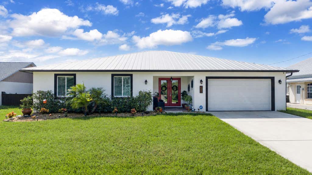 Photo of 314 NE Surfside Avenue, Port Saint Lucie, FL 34983 (MLS # B26058511)